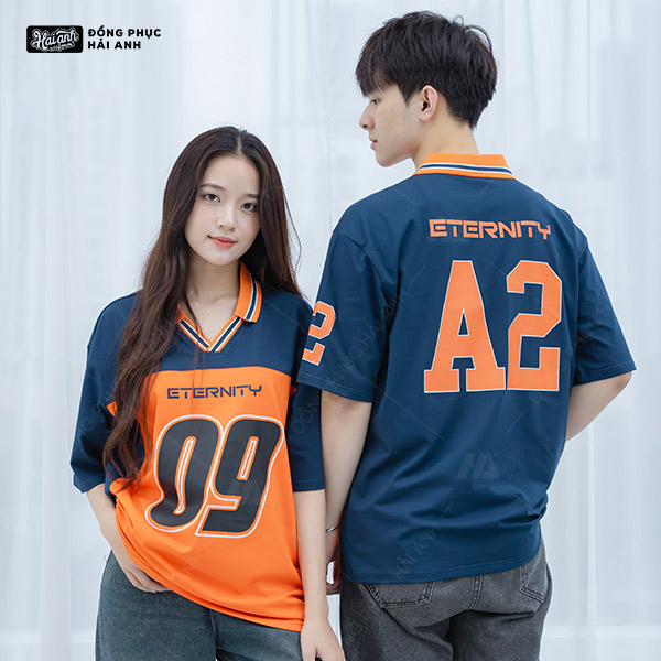 Áo lớp polo Iconic màu xanh đen phối thân cam